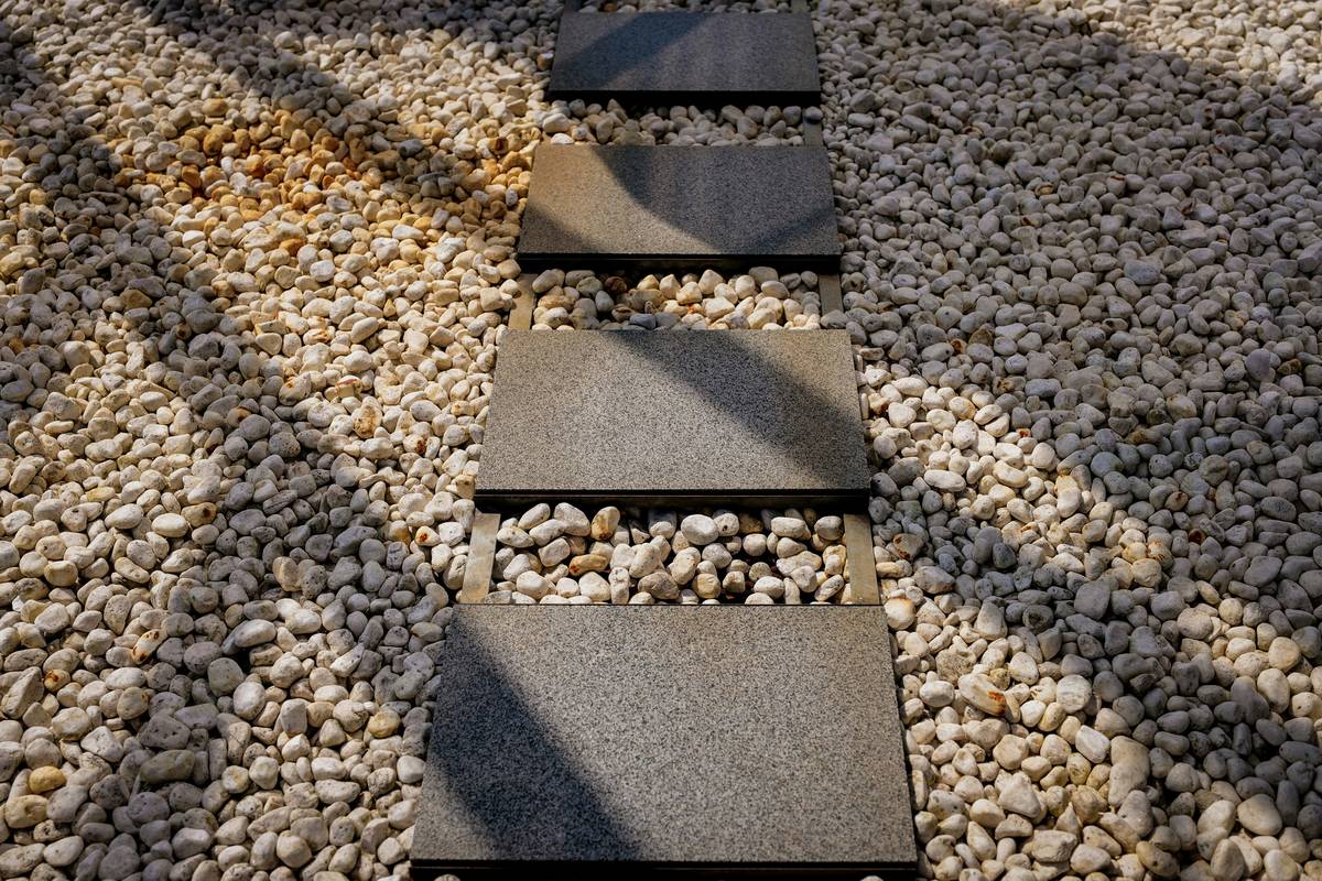 multi purpose gravel for gardens spread evenly over compacted base with defined edging and visible drainage separation from adjacent soil